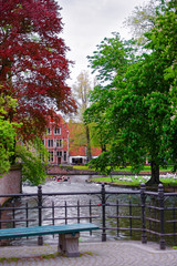 Fototapeta na wymiar Bench at Minnewaterpark and Minnewater lake in Bruges
