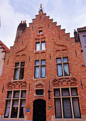 Fototapeta na wymiar Dragon House red brick building in Bruges