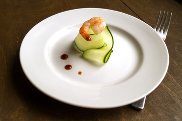 thinly sliced cucumber on a white plate