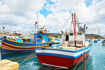 Fototapeta na wymiar Colorful boats at Marsaxlokk Harbor Malta