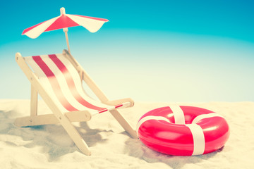 Deckchair and swimming ring on the beach