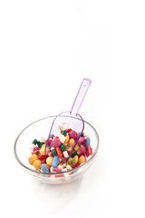 Many colorful pills isolated on white background