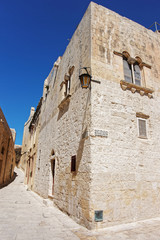 Narrow silent street with lantern in Mdina old town