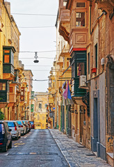 Street with traditional houses at old city center in Valletta