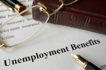 Unemployment Benefits concept written on a paper.