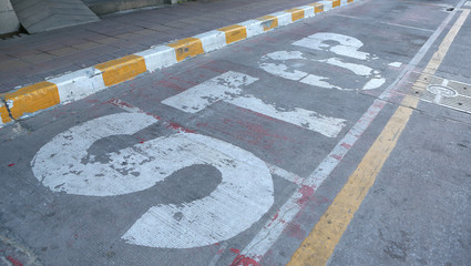 Fototapeta premium Old STOP sign painted on the road