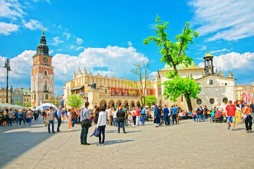 People at Cloth Hall and Town Hall Tower in Krakow
