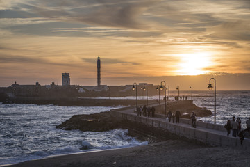 Castle of San Sebastian at sunset, fortress on a smail island separated from the main city, according classical tradition, there was a Temple of Kronos, cultural landmark of the city, Cadiz, Spain