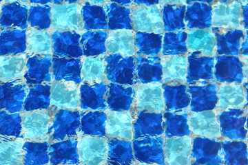 Abstract Blue mosaic tiles of swimming pool water for background