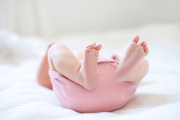 Feet of newborn baby with copyspace