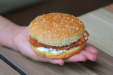 appetizing hamburger on hand