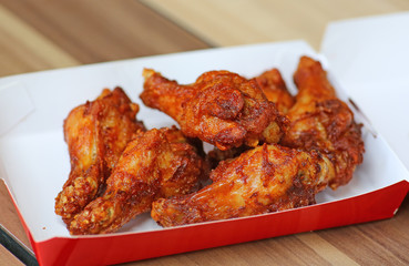 Hot and Spicey Buffalo Chicken Wings in cardboard delivery box