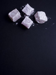 Turkish delight (lokom) isolated on black background