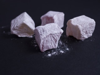 Turkish delight (lokom) isolated on black background