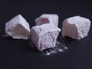 Turkish delight (lokom) isolated on black background