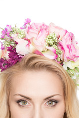 Flowering beauty. Cropped closeup shot of eyes of a gorgeous woman wearing flower wreath copyspace above isolated on white