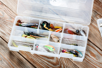 Fishing accessories on a wooden background. © Alex Ishchenko