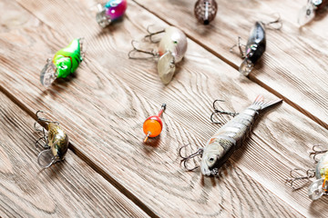 Fishing accessories on a wooden background. © Alex Ishchenko
