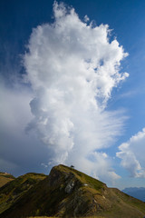 Summer mountain landscape with cumulus cloud