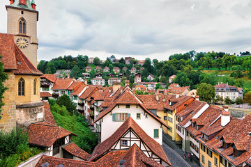Nydegg Church and old houses rooftops of Bern