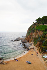Fototapeta na wymiar Beach at bay of Tossa de Mar on Costa Brava