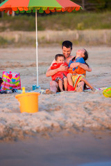 Mixed race family at the beach