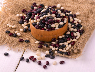 Colored haricot beans  in a wooden cup
