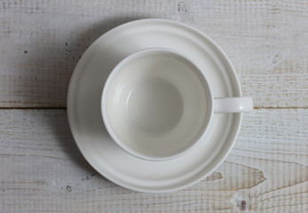 Empty tea, coffee cup on rustic wooden table. Minimalistic background