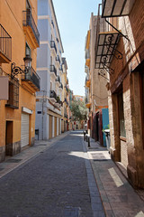 Narrow street in old city center of Valencia