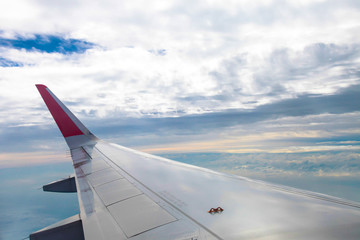 Fototapeta na wymiar Airplane wing fly on blue sky | Trip travel business | Transportation commercial