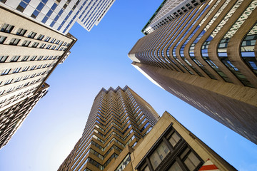 Fototapeta na wymiar Bottom up view of glass skyscrapers in New York in USA
