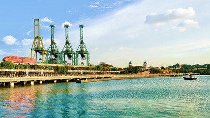Fototapeta premium Passenger Express Train and loading cranes Sentosa Island Singapore