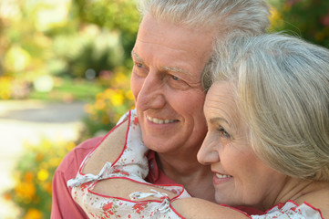 Happy elderly couple embracing