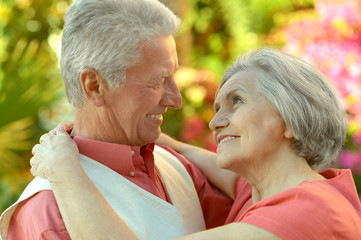 Happy elderly couple embracing