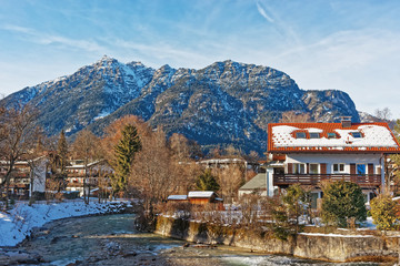 Alps Partnach River and wooden Chalets in Garmisch Partenkirchen