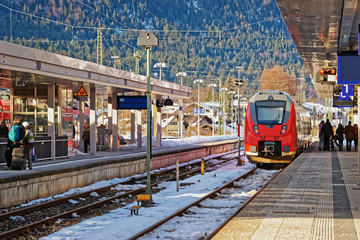 Passengers and high speed train at Garmisch Partenkirchen in Germany