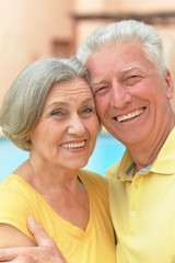 Happy elderly couple embracing