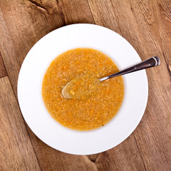 Vegetable soup on a wooden table