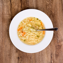 Vegetable soup on a wooden table