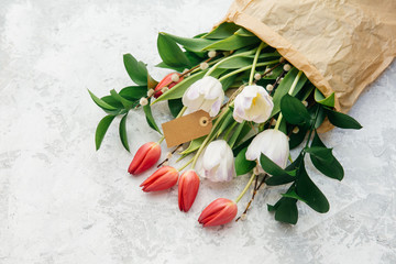  tulips over wooden table background