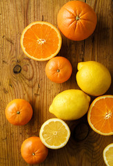 assorted citric fruits on aged wood