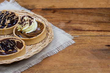 tartlets, basket cakes, sweet, tea on the wodden table