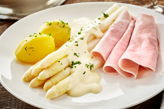 Tasty white asparagus spears with mayonnaise
