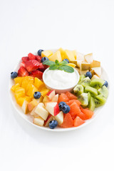 ingredients for fruit salad and natural yoghurt, vertical