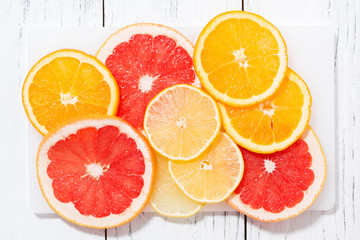 Slices of fresh citrus, closeup top view