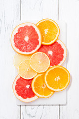 Slices of fresh citrus, vertical top view