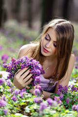 Fototapeta premium Portrait of a beautiful girl in corydalis