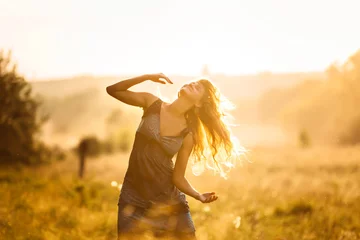 Fotobehang Dancing girl at sunset © Nadiia