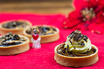 tartlets, basket cakes, sweet, tea on the wodden table