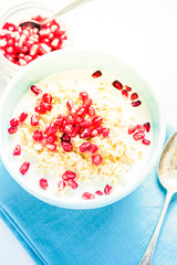 Fresh summer breakfast, cereals with pomegranate.